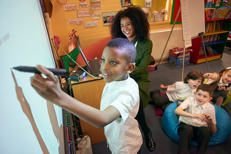 Student writing on whiteboard